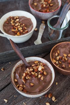 Delicious chocolate pudding with roasted almonds and caramel sauce