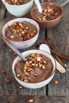 Delicious chocolate pudding with roasted almonds and caramel sauce