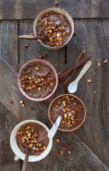 Delicious chocolate pudding with roasted almonds and caramel sauce