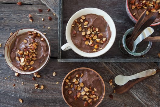 Delicious chocolate pudding with roasted almonds and caramel sauce