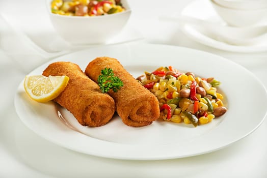 Bread crumbs rolls filled with ham and cheese. Fried Cannelloni or rolls.