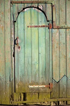 Old green wooden door.