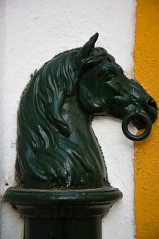 Horse hitching ring for tying horses.