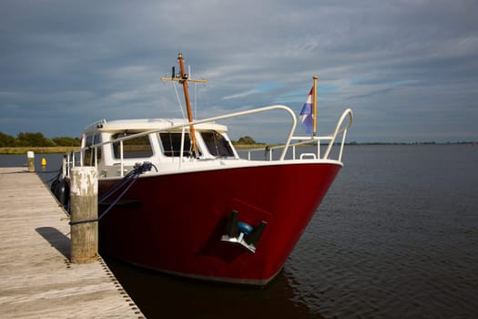 Dutch motorboat moored at the Alkmaardermeer Lake.