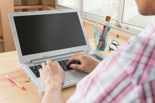 Pink Scott shirt businessman typing laptop or notebook in home office. Small business SME or start up businessman concept. Business and .technology about communication or contact