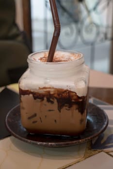 Iced coffee mocha serving on table, stock photo