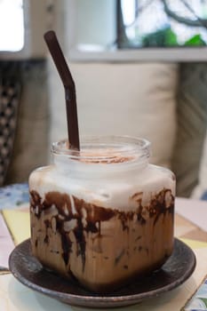 Iced coffee mocha serving on table, stock photo