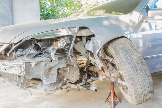 Car or automobile is crashed at front side or car insurance concept. Crashed car for car insurance story in car service shop or garage. Business in .term insurance category