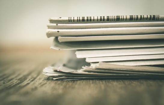 Newspaper on Wood Concept about Journalist or Business. Foreign Newspaper background