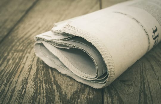 Newspaper on Wood Concept about Journalist or Business. Foreign Newspaper background