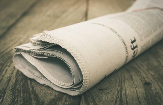 Newspaper on Wood Concept about Journalist or Business. Foreign Newspaper background