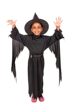 Girl in Halloween witch costume over a white background