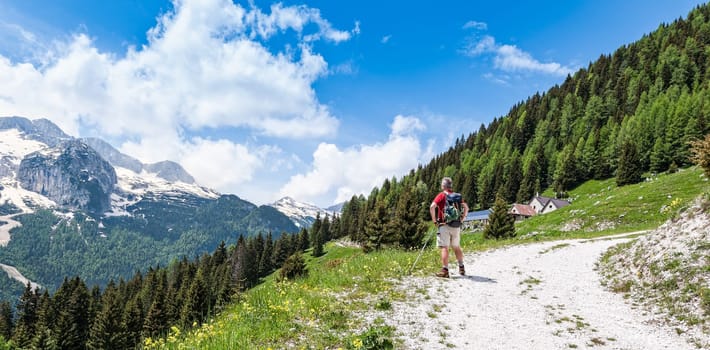 Mature hiker about 60 years old. Hiking  on mountains. Active retirement. Healthy Lifestyle.