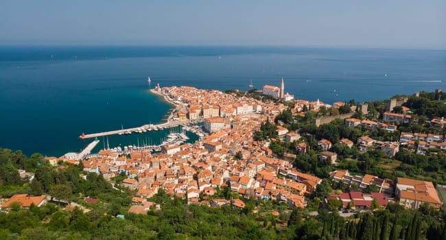 Aerial view of old town Piran. Splendid summer day on Adriatic Sea. Beautiful cityscape of Slovenia, Europe. Traveling concept background. Magnificent Mediterranean landscape.
