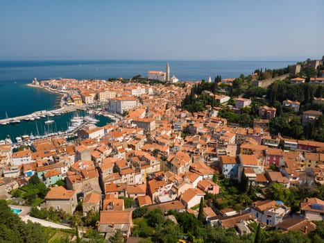 Aerial view of old town Piran. Splendid summer day on Adriatic Sea. Beautiful cityscape of Slovenia, Europe. Traveling concept background. Magnificent Mediterranean landscape.