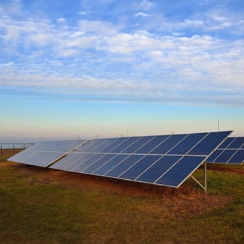 Solar power plant - concept for electricity and ecological industry. High energy prices. Clean energy and environment. power full of natural energy.
