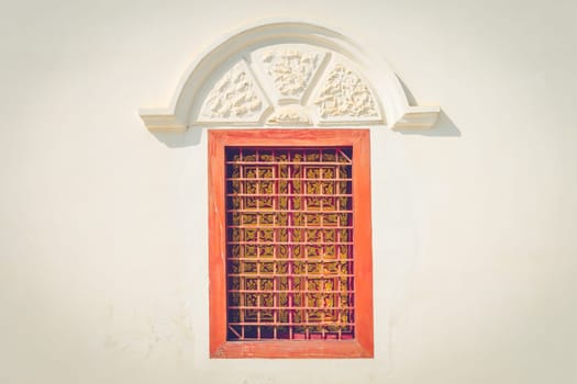 Closed Orange Brown Windows Frame Background. Windows frame of temple with Thai art design. Classic windows frame for design