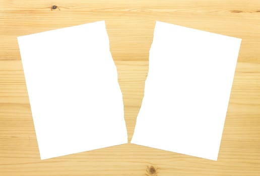 White Ripped Paper in Half on Wood Background. White torn paper 2 part for separate or partition or divide concept