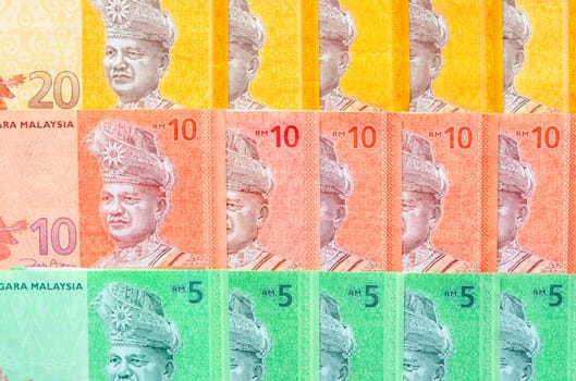 Malaysia currency of Malaysian ringgit banknotes background. Paper money of five, ten and twenty ringgit notes. Financial concept.