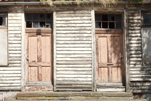 old doors on an old condemned wooden house
