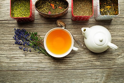 Cup of tea with dry tea collection of different types