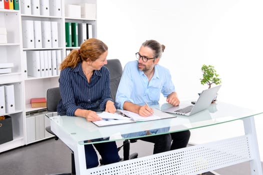 young businessman and businesswoman working together in the office