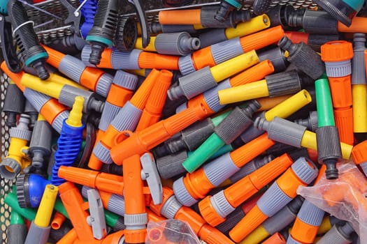 Various colorful garden hose nozzles sprayer parts