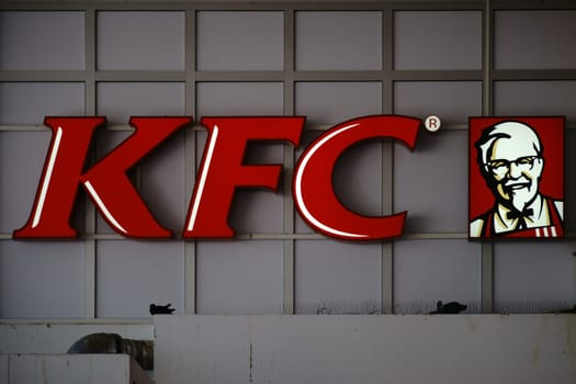Saarbrücken,Germany - July 29,2018: The logo of the fast food restaurant Kentucky Fried Chicken at Saarbrücken Central Station on July 29,2018 in Saarbrücken.