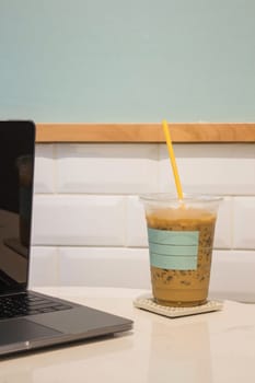 Laptop on table in coffee shop, stock photo
