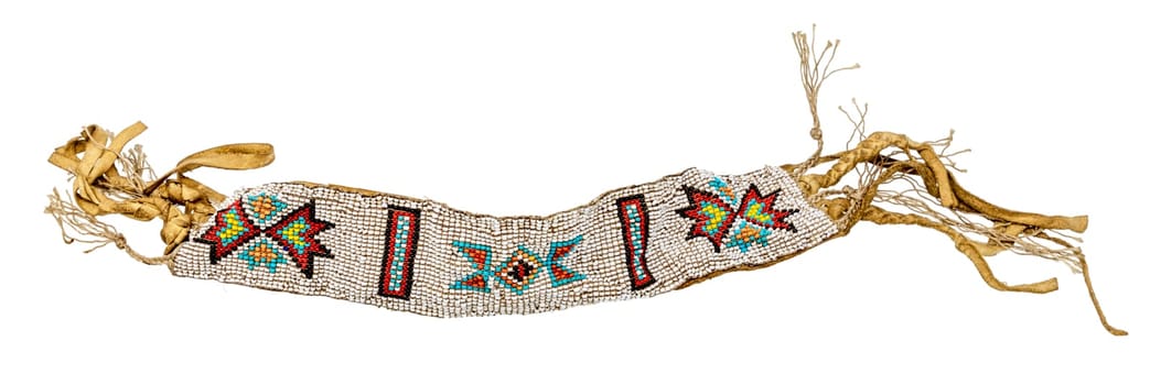 Old Native American bracelet sewn as jewelry / pearl weaving on leather isolated on white