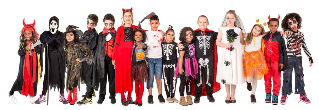 Group of kids in Halloween/Carnaval costumes isolated