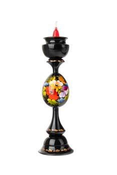 Candlestick. Hand painted colorful wooden candlestick with a candle isolated on white background.