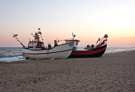 standing fishing boats on the sea