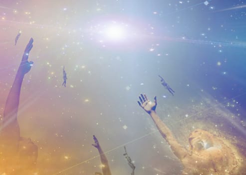 People soaring toward light among stars.
