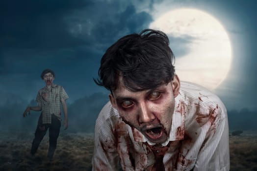 Bloody zombies hanging around on the midnight with full moon background
