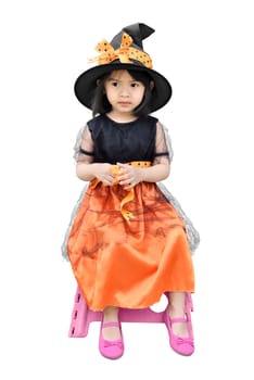 Portrait if asian little girl with halloween witch dress and hat isolated over white background