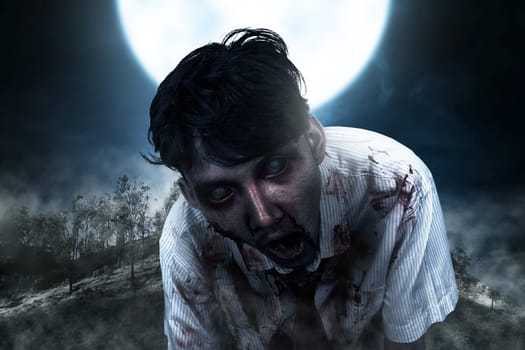 Spooky zombie man with blood hang around on the midnight. Halloween concept