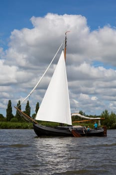 Heeg, Friesland, The Netherlands - August 5, 2018  Dutch traditional ship is sailing near Heeg, Friesland, The Netherlands.