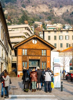 Como, Italy, January 1st 2016: Tourists waiting in queue at the Como funicular transport system station