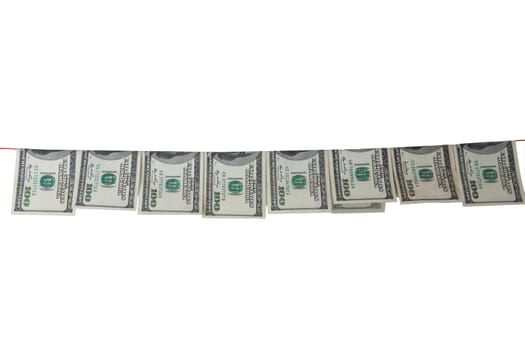 Hundred dollar bills hanging on clothesline are isolated on white background. Concept money laundering.