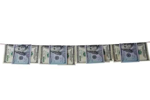 Hundred dollar bills hanging on clothesline are isolated on white background. Concept money laundering.