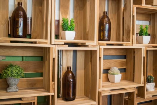Decorative tube bottles on wooden shelf, stock photo