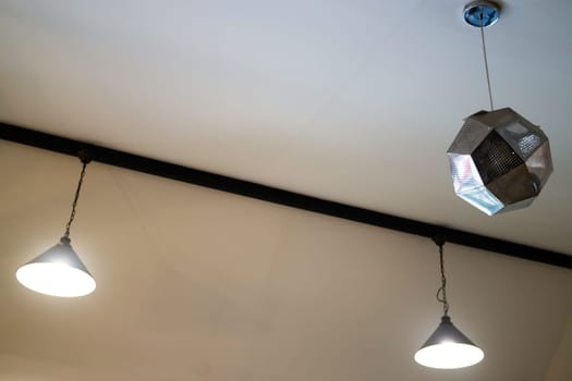 Illuminated ceiling warm light lamp, stock photo