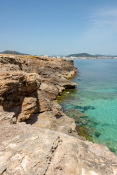 View over the clear turquoise waters of the Mediterranean to the beach of Cala Millor on the Spanish Mediterranean island Mallocra