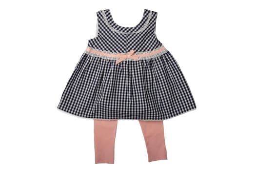 Clothes for children, a black and white checkered baby girl dress and a leggings isolated on white background. Children fashion.