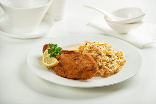 Homemade breaded or fried chicken steak with vegetable salad