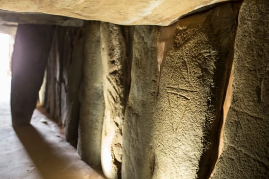 Trigueros, Spain - July 2nd, 2018: Dolmen de Soto engravings, daggers. The biggest one megalithic monument in the province of Huelva, Spain