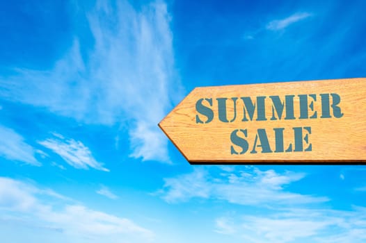 Wood arrow sign against clear blue sky with Summer Sale, Retail sale concept
