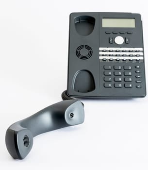 modern voip phone isolated on grey background. single object