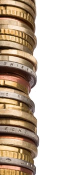 huge tower of different euro coins in close up shot isolated in white background